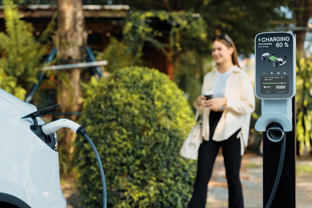 Electric car charging at a renewable energy charging station